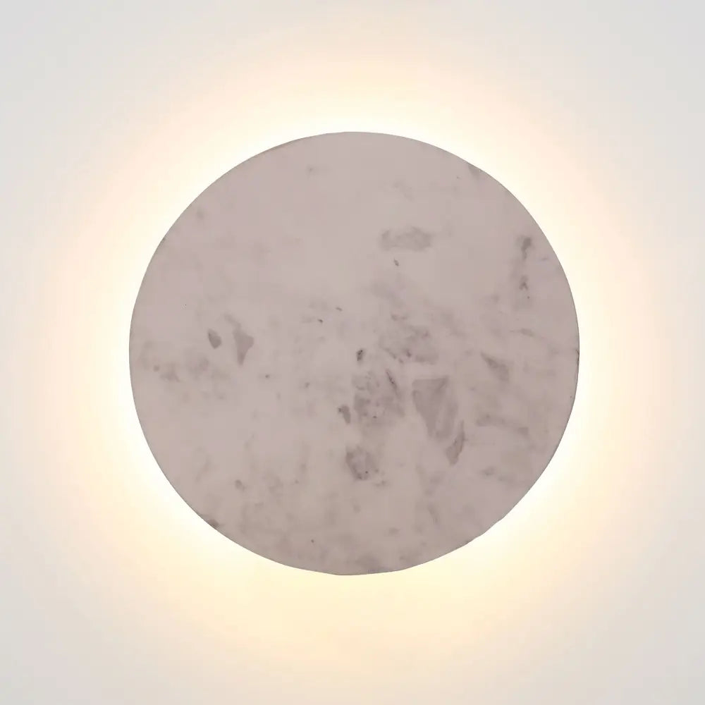 Round marble surface with a light background. Dot 25 grey