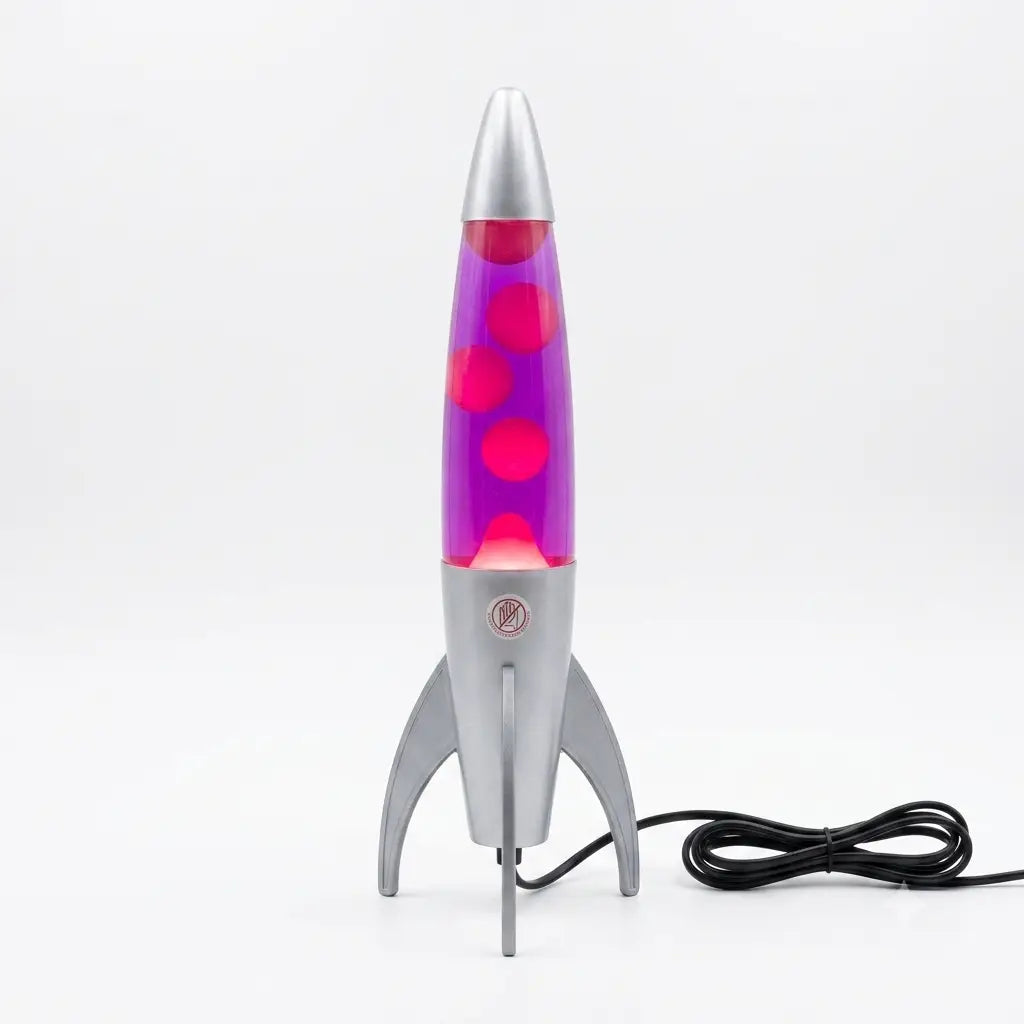 A retro-style rocket-shaped lava lamp with a metallic silver body and three legs, featuring a purple glass chamber filled with pink wax and glowing pink bubbles, shown on a white background with its black power cord.