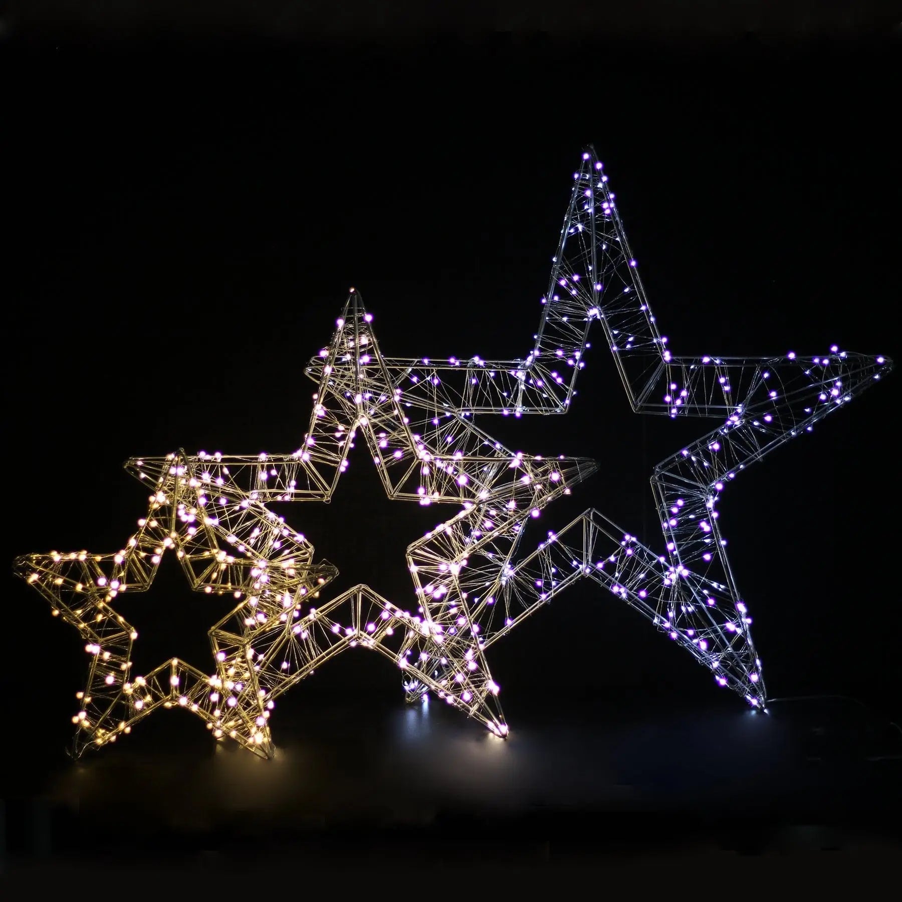 Three illuminated LED Christmas star decorations in dual colour with warm white Christmas light options