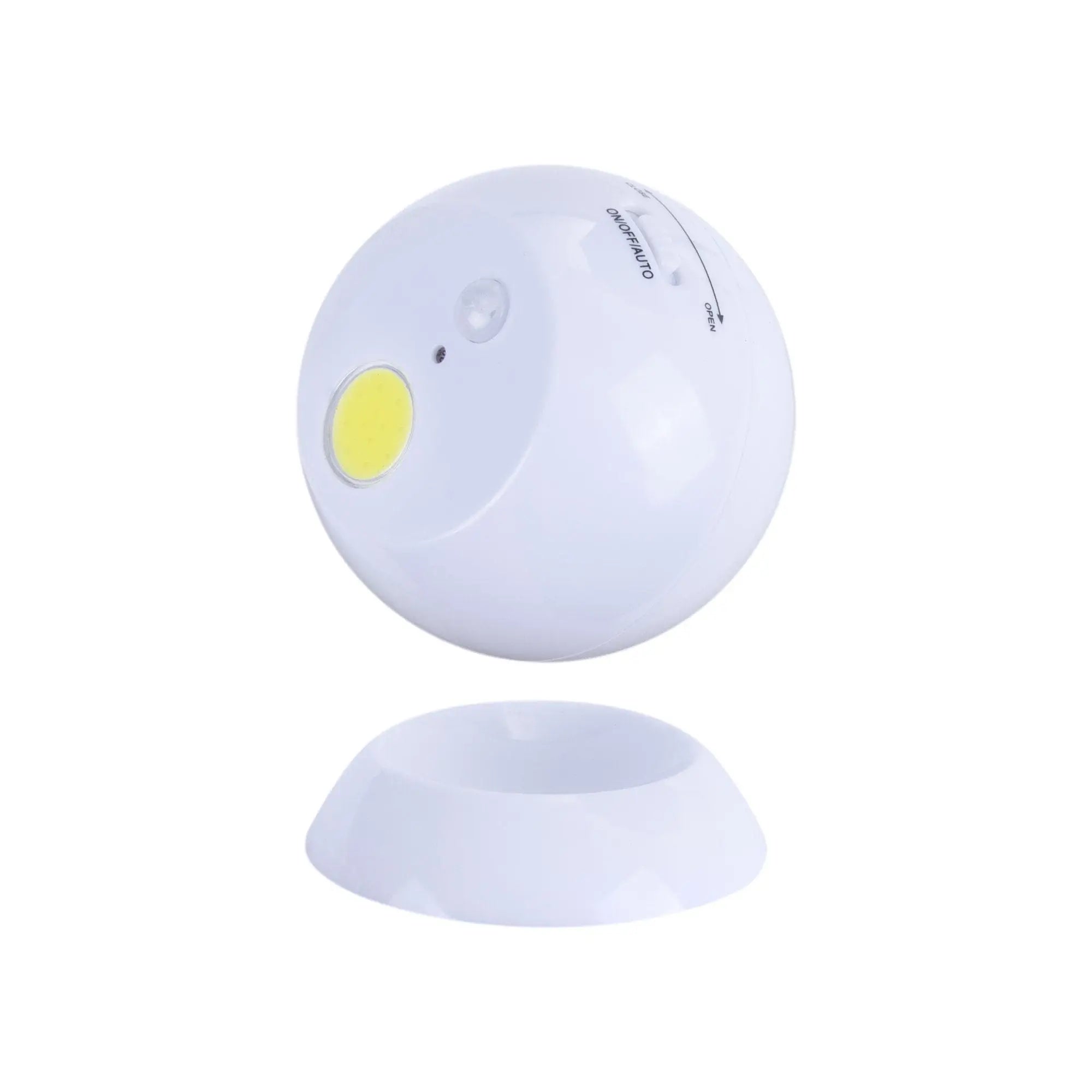 White spherical motion activated swivel ball light with yellow led and magnetic base for versatile use