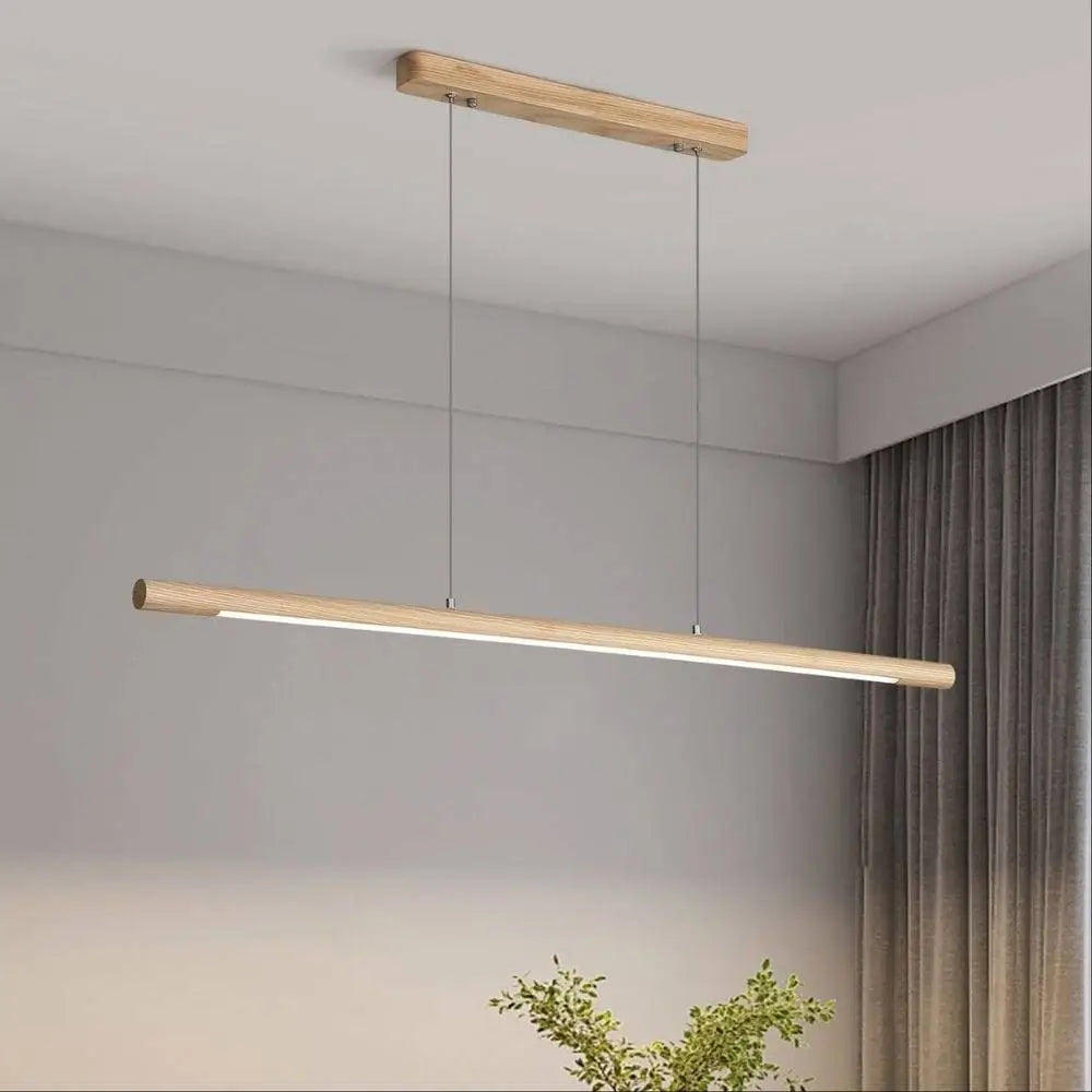 Handcrafted ash timber linear pendant suspended by stainless steel wire.