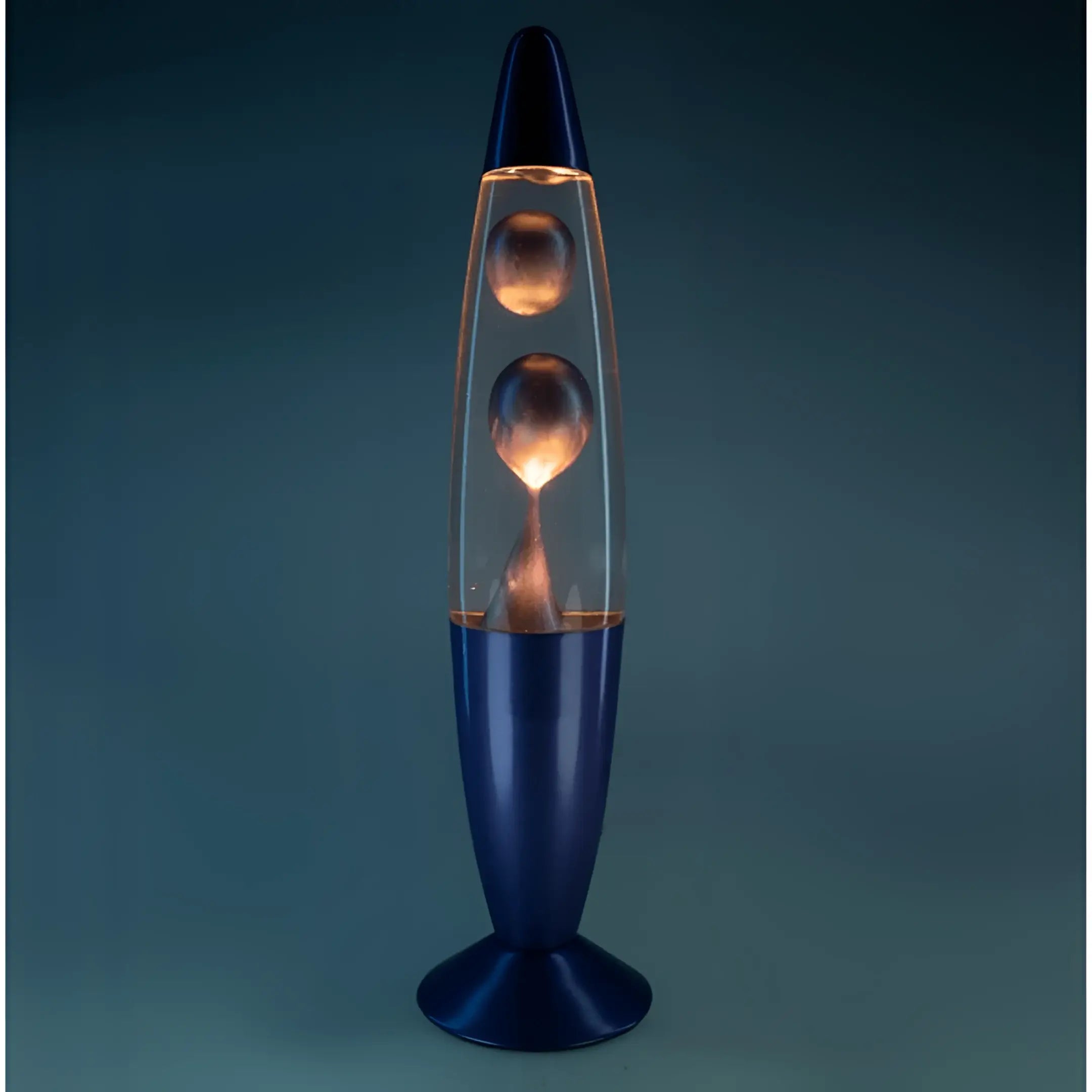 Lava lamp with blue base and black top, clear glass body containing glowing orange liquid.