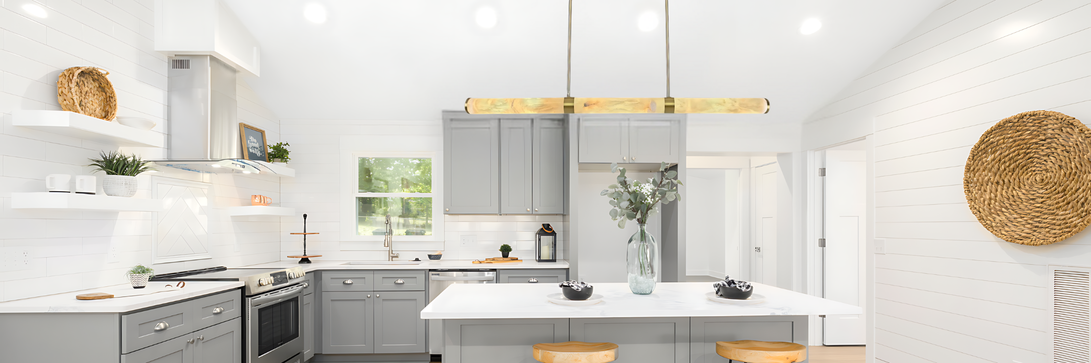 Geometric pendant lights in bold colours hang above a kitchen island in a contemporary kitchen.