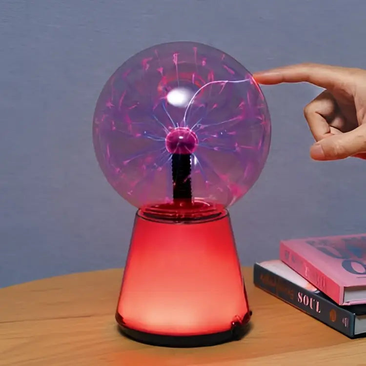 Colour changing plasma ball with red base, transparent sphere, central electrode