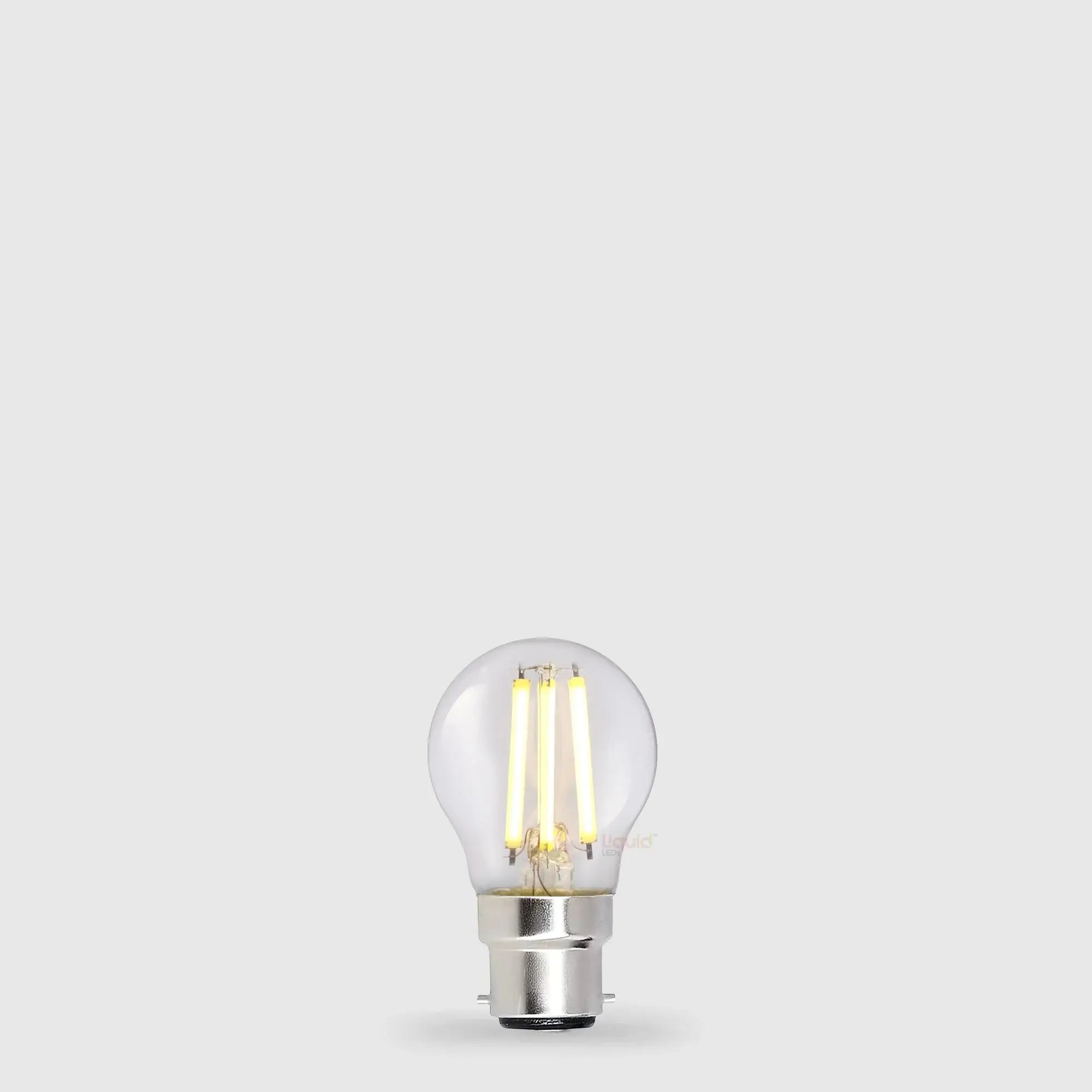 5.5W Dimmable Fancy Round LED Bulb B22 Clear in Warm White