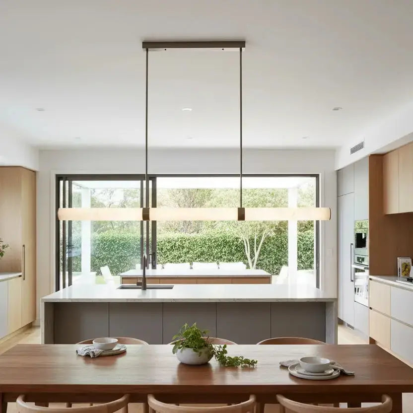 Modern kitchen island bench lighting featuring the Madison 1500mm antique brass and alabaster marble linear pendant light.