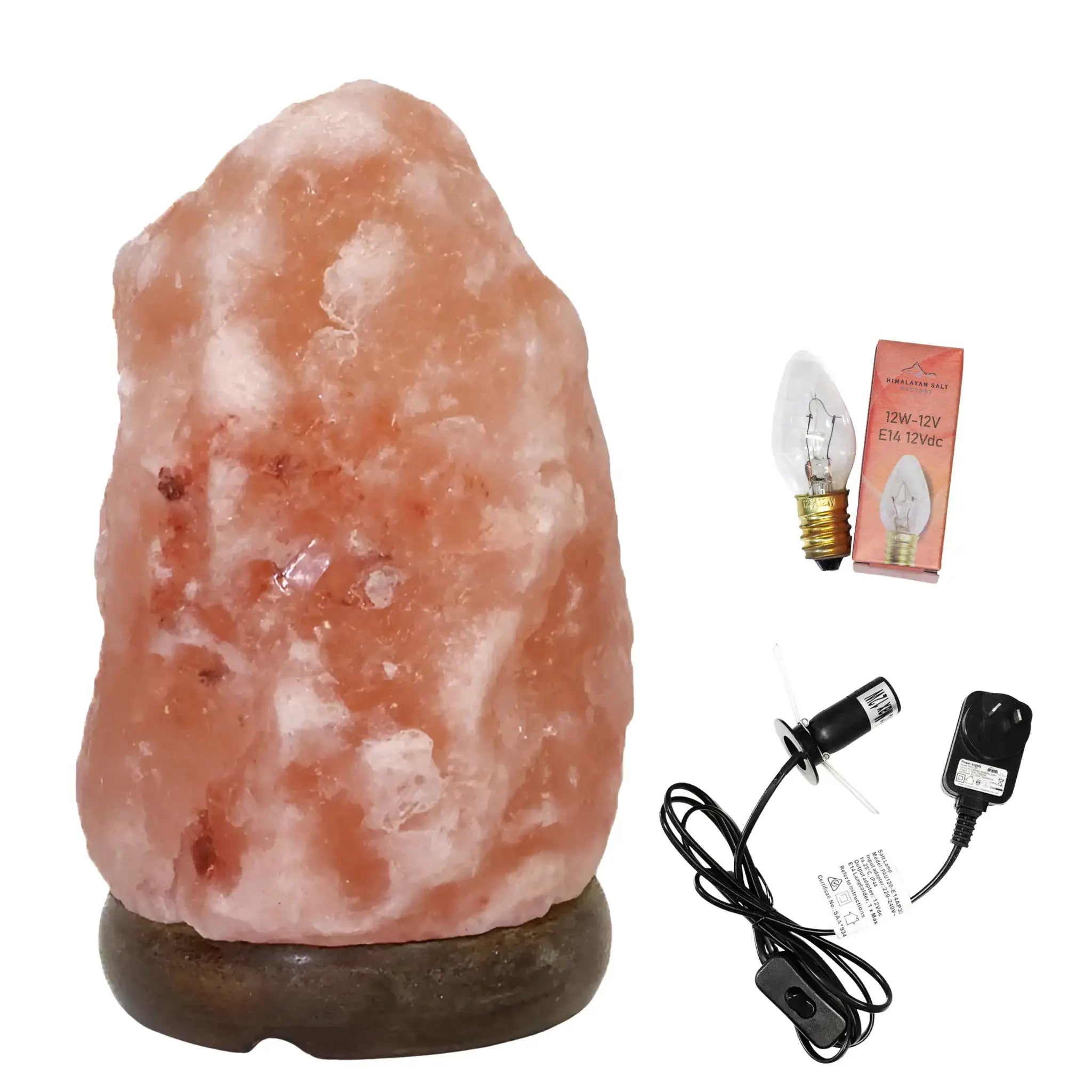 Himalayan salt lamp with bulb, adapter, and power cord on a white background