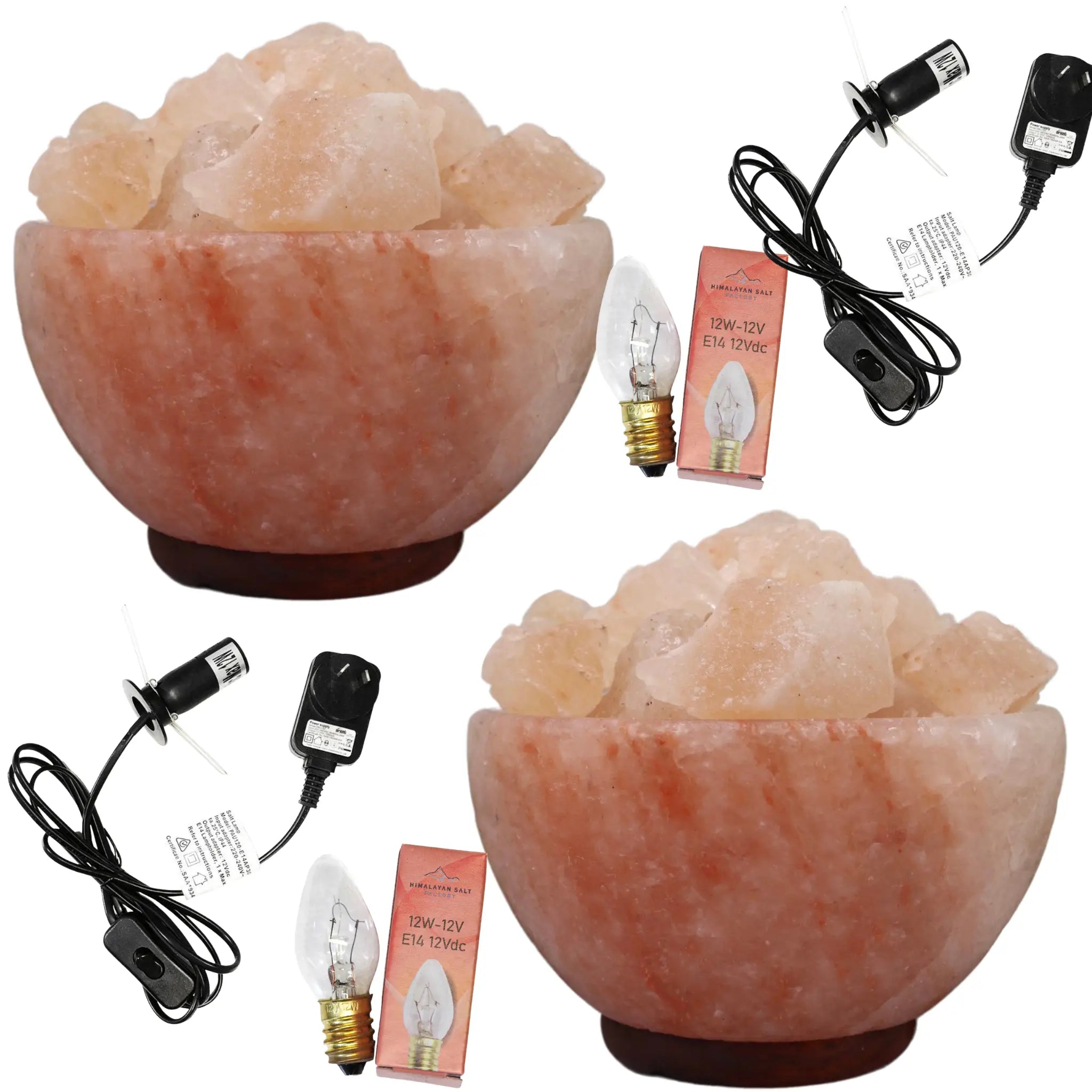 Two Fire bowl Himalayan salt lamps with accessories on a white background