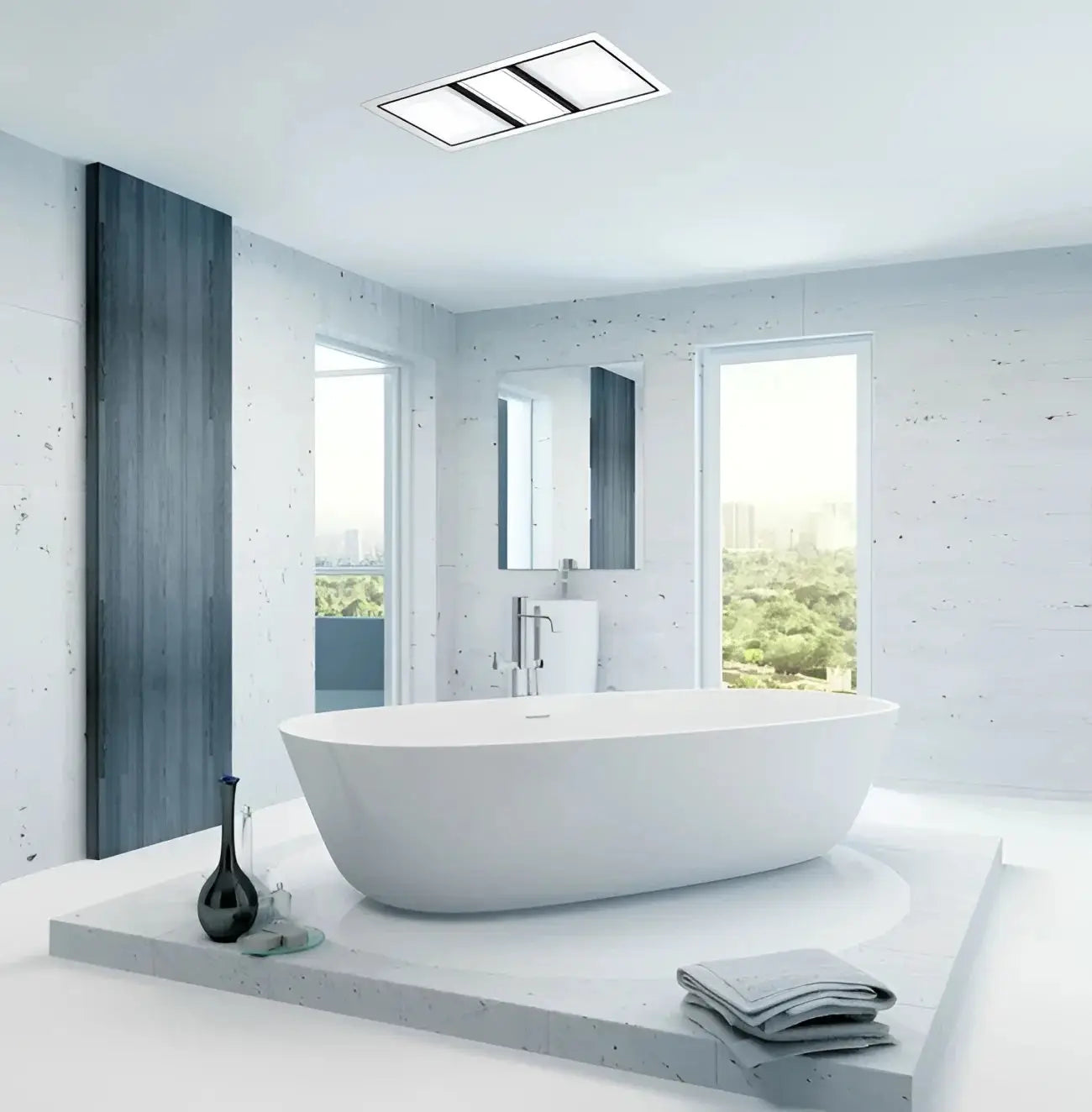 Modern white freestanding bathtub complementing ixl tastic luminate dual bathroom heater light fan in white