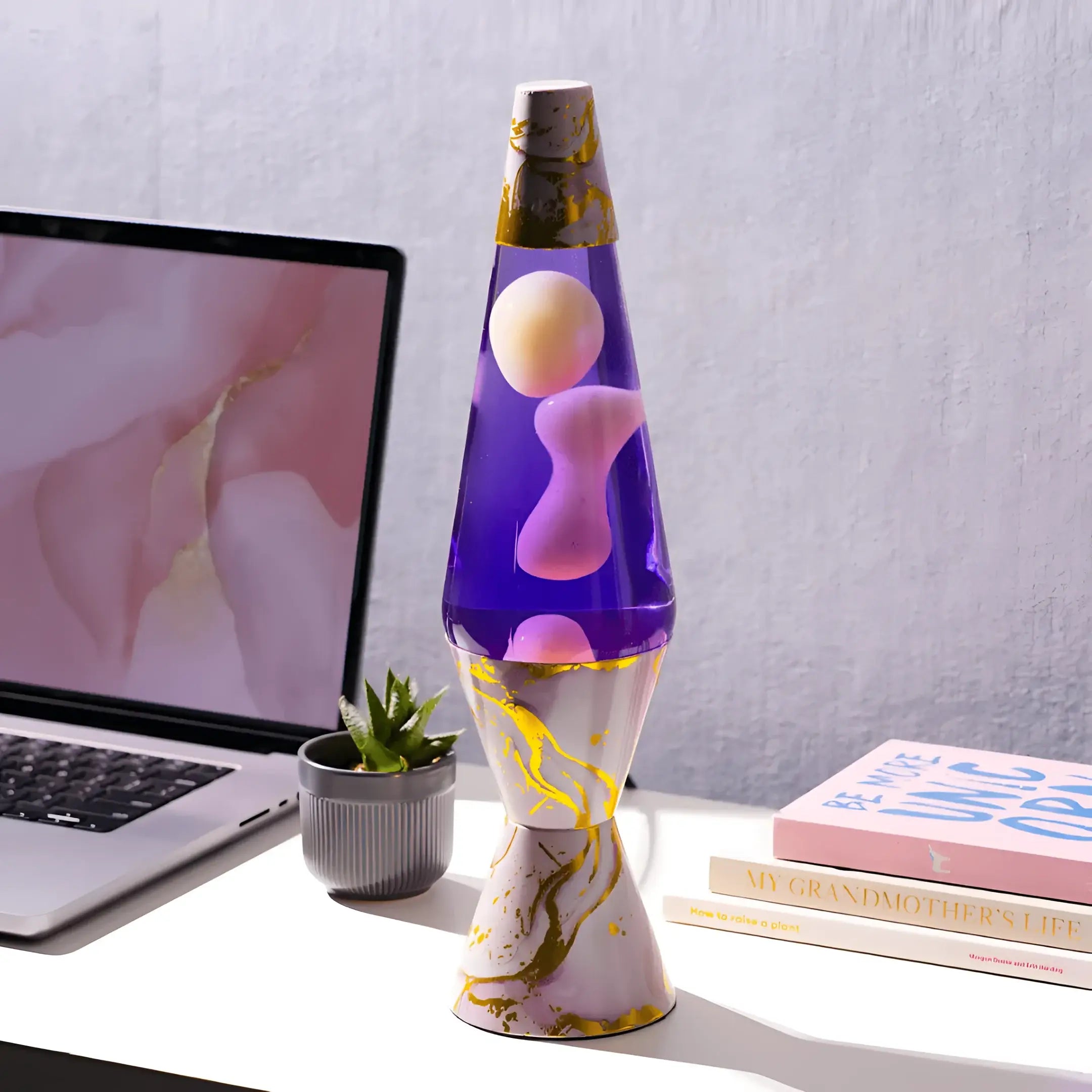 Purple lava lamp with gold accents and pink marble finish base inspired by diamond motion lava lamp pink marble design