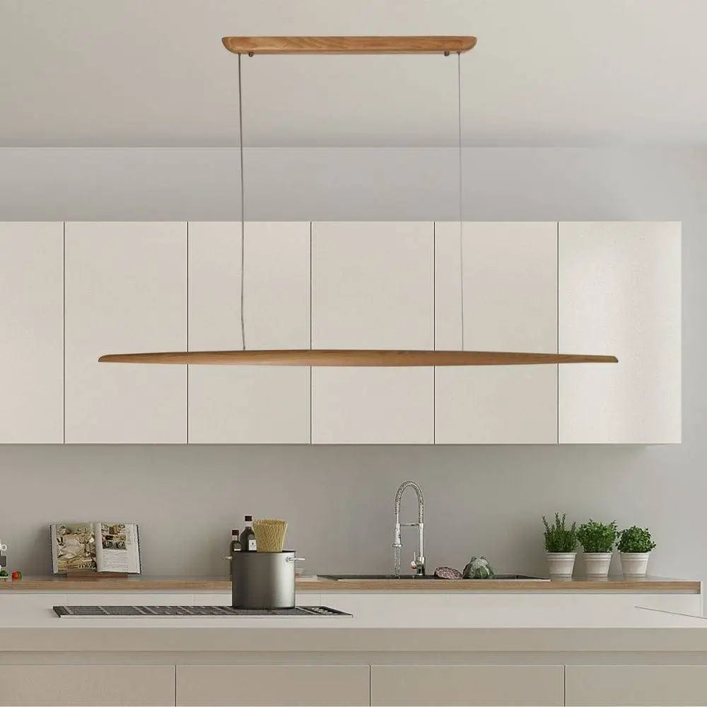 Modern linear ash wood pendant light suspended above a dining area.