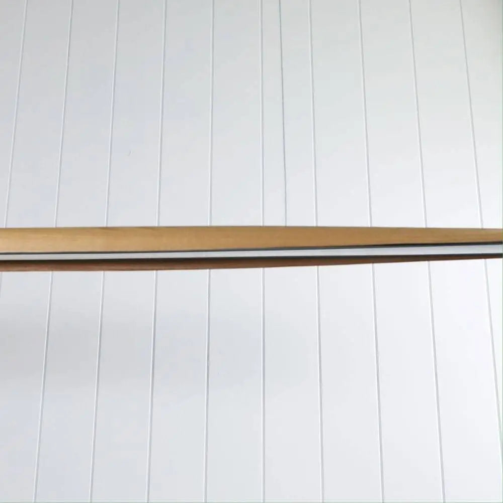 Close-up of the Eastoff pendant’s natural ash wood canopy.
