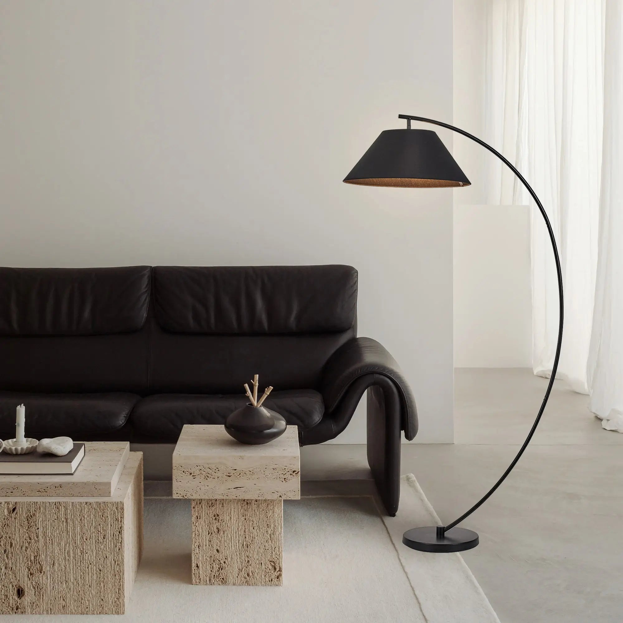 Remi floor lamp black brass with black leather sofa rolled arms