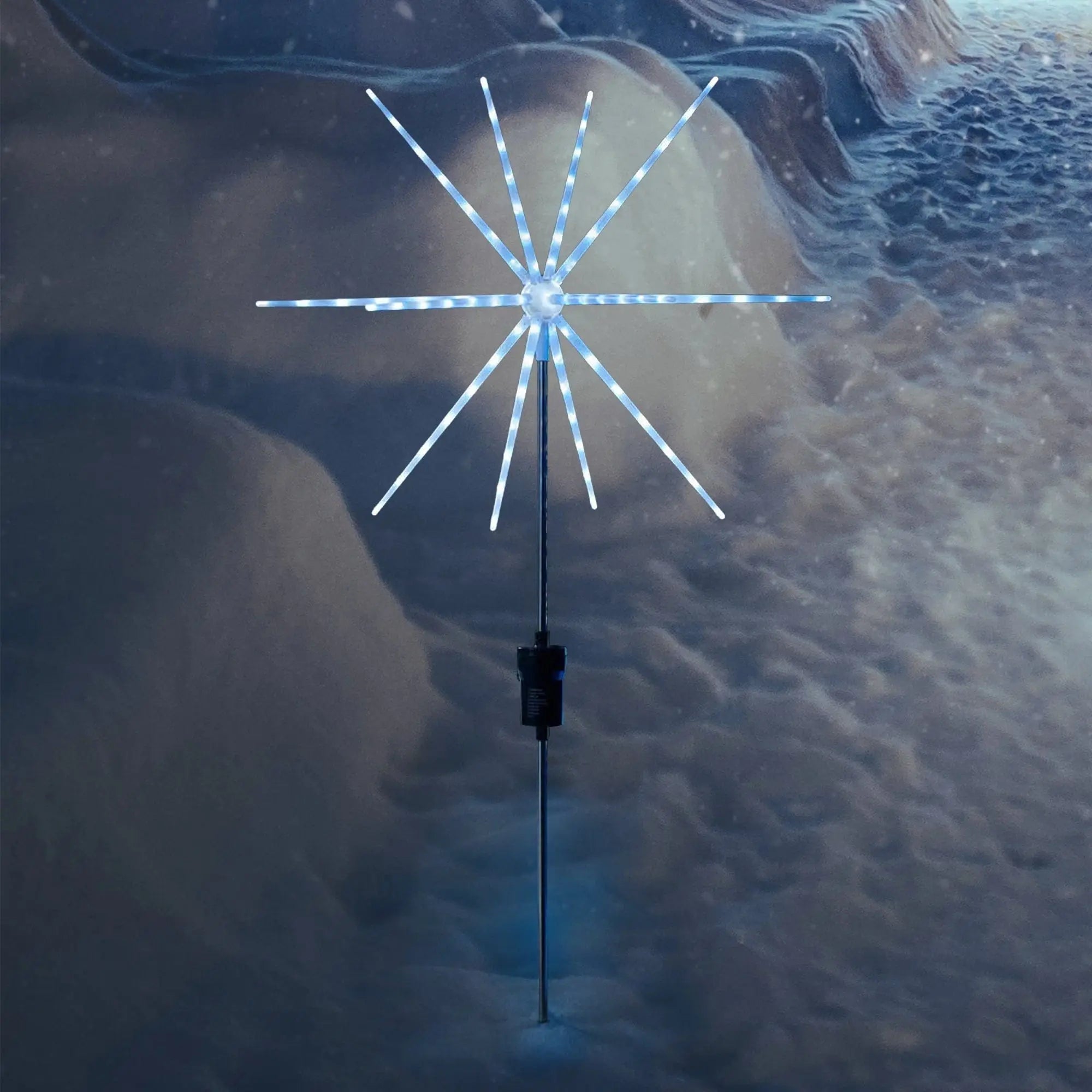Solar powered starburst pathway stake light with illuminated blue and white snowflake design 50cm height